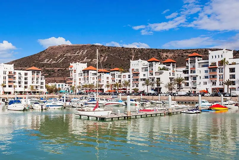 Boats at the Marina harbour in Agadir. Agadir is a major city in Morocco located on the shore of the Atlantic Ocean, near the Atlas Mountains.